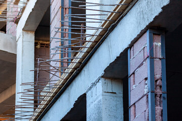 Fototapeta na wymiar Building that is being built, concrete and sticking fittings