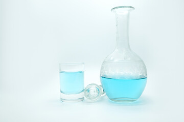 blue alcoholic drink in a decanter. Cocktail with blue gin , tonic