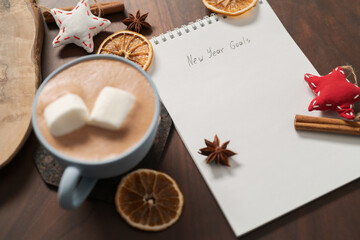 Hot chocolate in a blue cup with natural christmas decorations