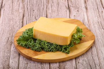 Tasty yelloow Tilsiter cheese brick
