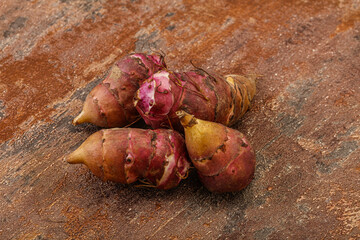 Raw topinambur root or Jerusalem artichoke