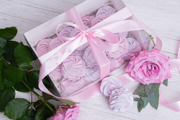 Purple marshmallow and rose in a beautiful festive packaging