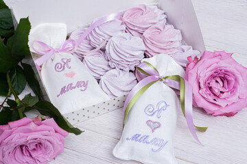 Purple marshmallow and rose in a beautiful festive packaging