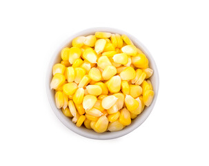 Corn in white bowl isolated on white background. Top view.