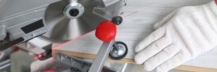 Carpenter clamp laminate with vice for sawing. High performance electric saws. Buy laminate...