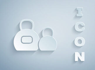 Paper cut Kettlebell icon isolated on grey background. Sport equipment. Paper art style. Vector.