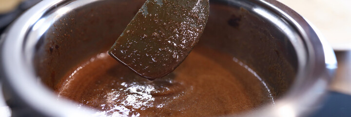 Close-up cooking caramel sauce in pan at home. Master new profession and skills cook. Proven recipes from chefs and pastry chefs. Varied breakfasts quick and easy. Learn to bake at home