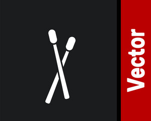 White Drum sticks icon isolated on black background. Musical instrument. Vector.