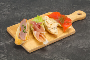 Tapas - bruschetta with prosciutto, salmon, duck and gorgonzola