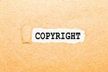 text COPYRIGHT on a torn piece of paper, business concept