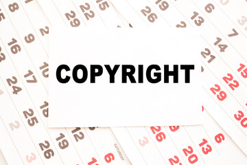 text COPYRIGHT on a sheet from Notepad.a digital background. business concept . business and Finance.