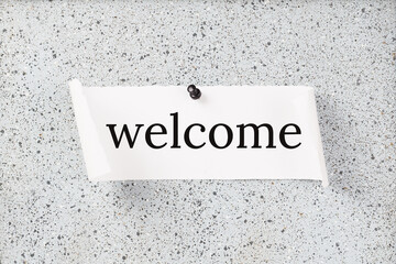 WELCOME text on notice board on top of office desk. Business finance meeting or workshop presentation and education concept. welcome and onboarding or induction. Copy space