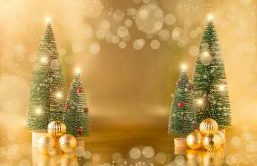 Golden Christmas balls on the background of Christmas trees on a Golden background. Christmas card. space for text