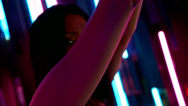 sexual face of dancing stripper in nightclub, voluptuous and sexy woman