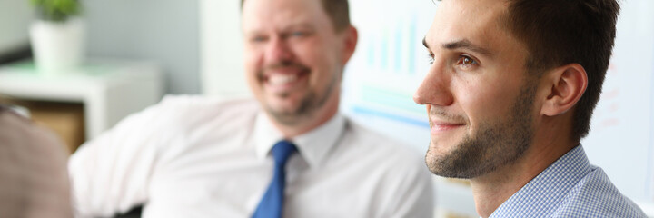 Fototapeta premium Close up of kind man that sitting in semi position in the meeting room and listening to lecture