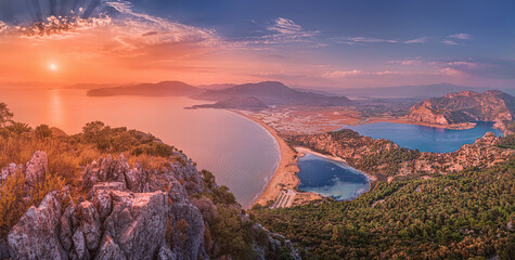 Majestic panoramic sunset view from top of the mountain to the blue sea and lakes near the town of...