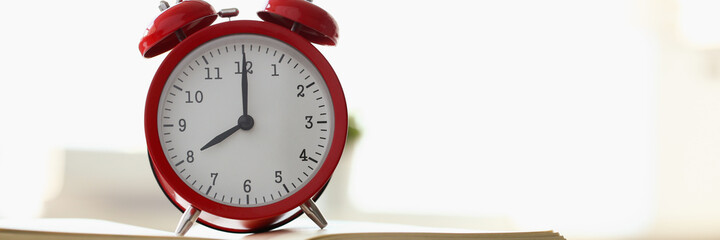 Close up of rare alarm clock that being set at eight in the morning