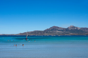 Obraz premium Calvi beach in summer view of the turquoise blue sea with the mountains in the background