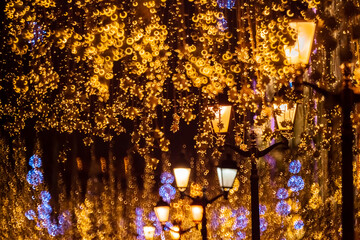 Bright Christmas Street Illumination. The City is Decorated for the Christmastide Holiday. New Year Lights Decorating Shimmering bokeh. Nikolskaya street.