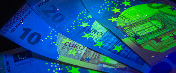Euro currency in UV light protection.Euro in UV light.Euro currency in UV light protection.