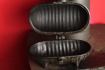 Potato baker designed to sit on top of all cast iron wood burners and multi fuel stoves