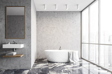 Naklejka na ściany i meble Panoramic concrete bathroom interior with tub and sink