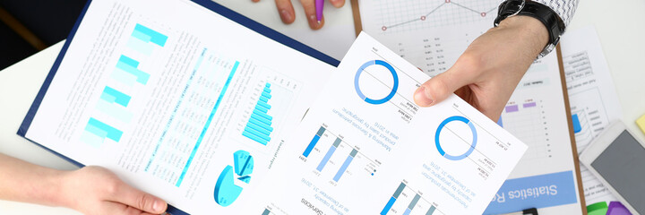 Focused photo on scheme of financial progress that being in use during business meeting