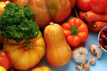 Beautiful assortment of colorful vegetables on blue background
