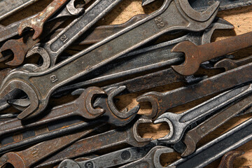 old vintage hand tools - set of wrenches on a wooden background