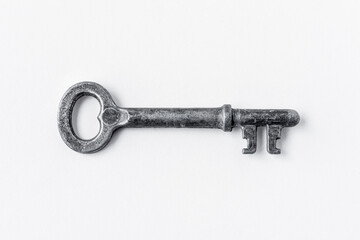 Metal key on a white background, close-up. Isolated.
