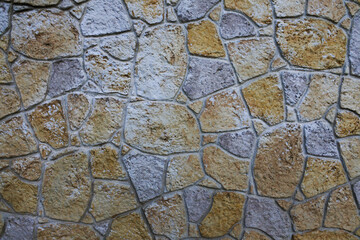 Muro de piedra natural tallada