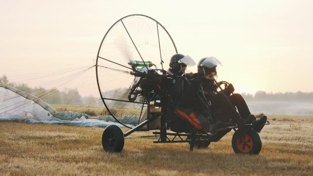 Paramotorgliding. Tandem paraglider rising in the air. High quality 4k footage