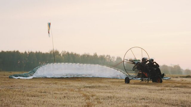 Paramotorgliding. Tandem paraglider rising in the air. High quality 4k footage