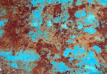 Rusty steel sheet with remnants of paint