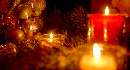 New Year's candles in Christmas trees with beautiful sides in the background in the New Year and Christmas