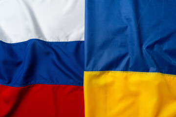 Flags of Russia and Ukraine folded together