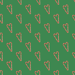 Red striped candy canes of Santa are stacked in the shape of a heart seamless pattern, ornament. Christmas, new year, Valentine's day, winter holiday atmosphere for lovers and loved ones