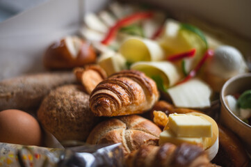 croissant lies on a variation for breakfast served in a box to have vegetarian breakfast at home