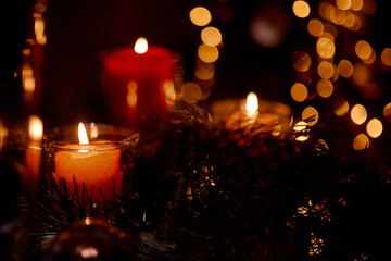 New Year's candles in Christmas trees with beautiful sides in the background in the New Year and Christmas