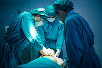 Surgical team or doctor and staff have vivisection in surgery room of the hospital and using equipment tool for the operation