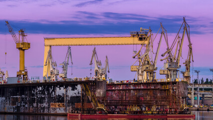 Fototapeta na wymiar SHIPAYARD - Floating dock, gantry and cranes on repair quays