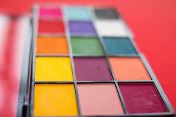 Makeup  palette on a pink background