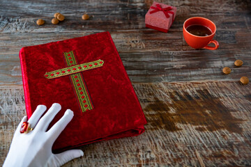 red velvet book with golden cross.  Typical Dutch tradition on the 5th of December called...