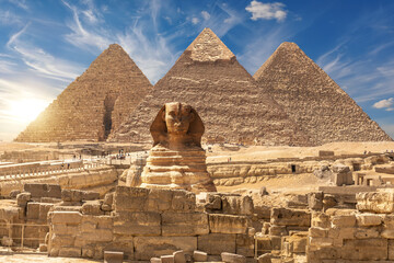 The Sphinx and The Great Pyramids of Giza near the ruins of a temple in Giza, Egypt