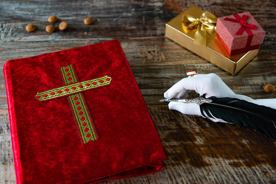 red velvet book with golden cross.  Typical Dutch tradition on the 5th of December called Sinterklaas