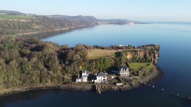 Aerial view Aberdour Harbour and Rock, Aberdour village, Fife, Scotland. Over the rock view Silver Sands beach.