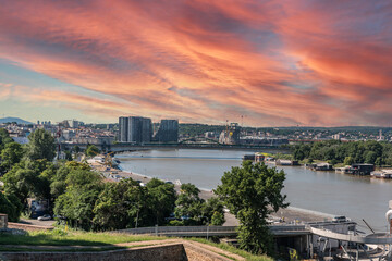 Fototapeta na wymiar View at Serbian capital city Belgrade with Sava river bridges and beautiful sundown in the evening from Kalemegdan fortress