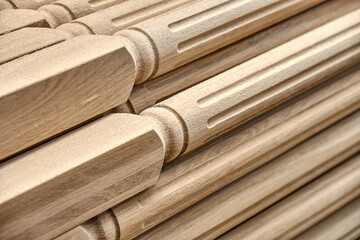 Turning wooden stair balusters. Wood stair balusters stacked in workshop