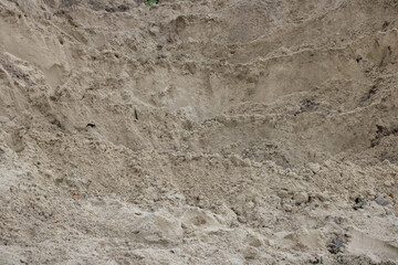 Pile of sand in close-up. Construction sector.