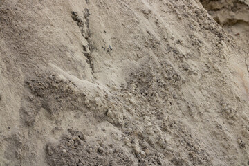 Pile of sand in close-up. Construction sector.